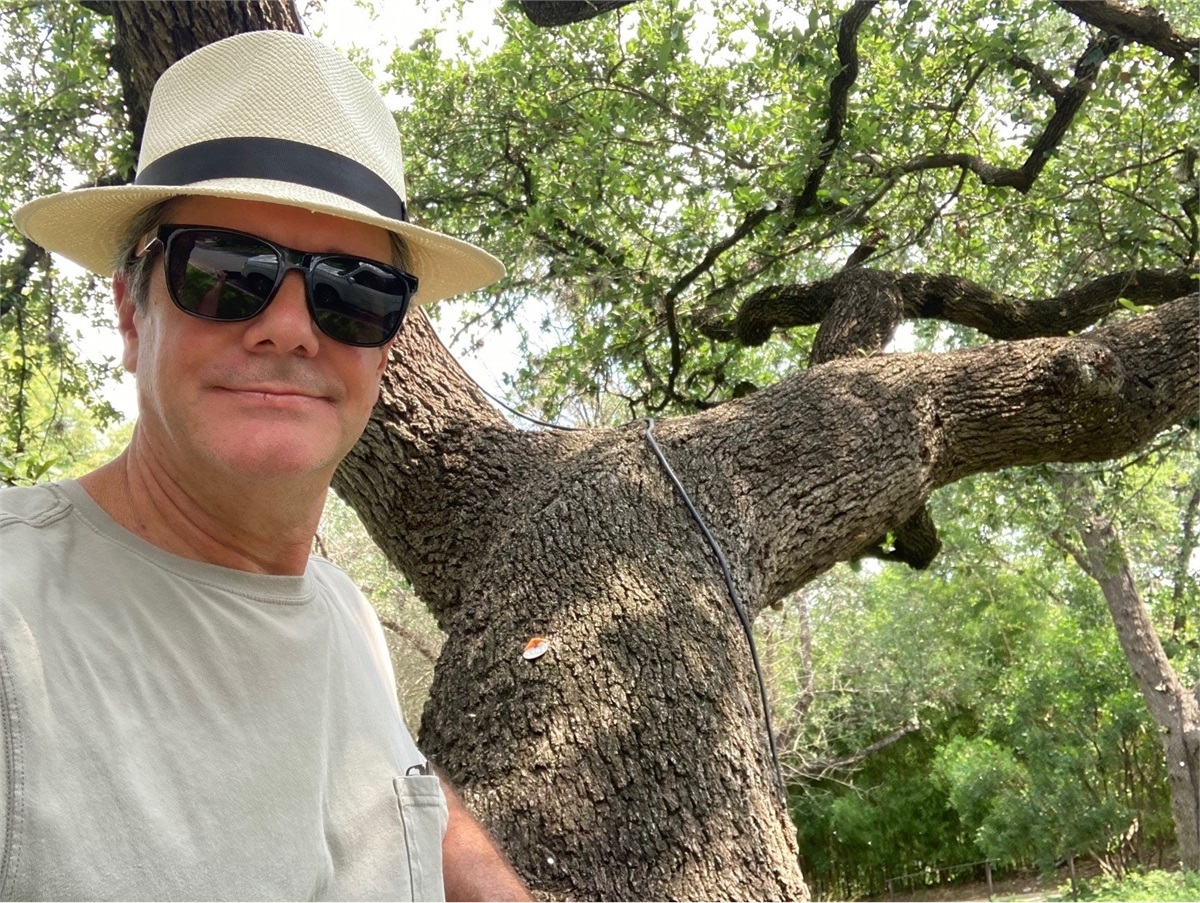 Scott in front of large oak tree